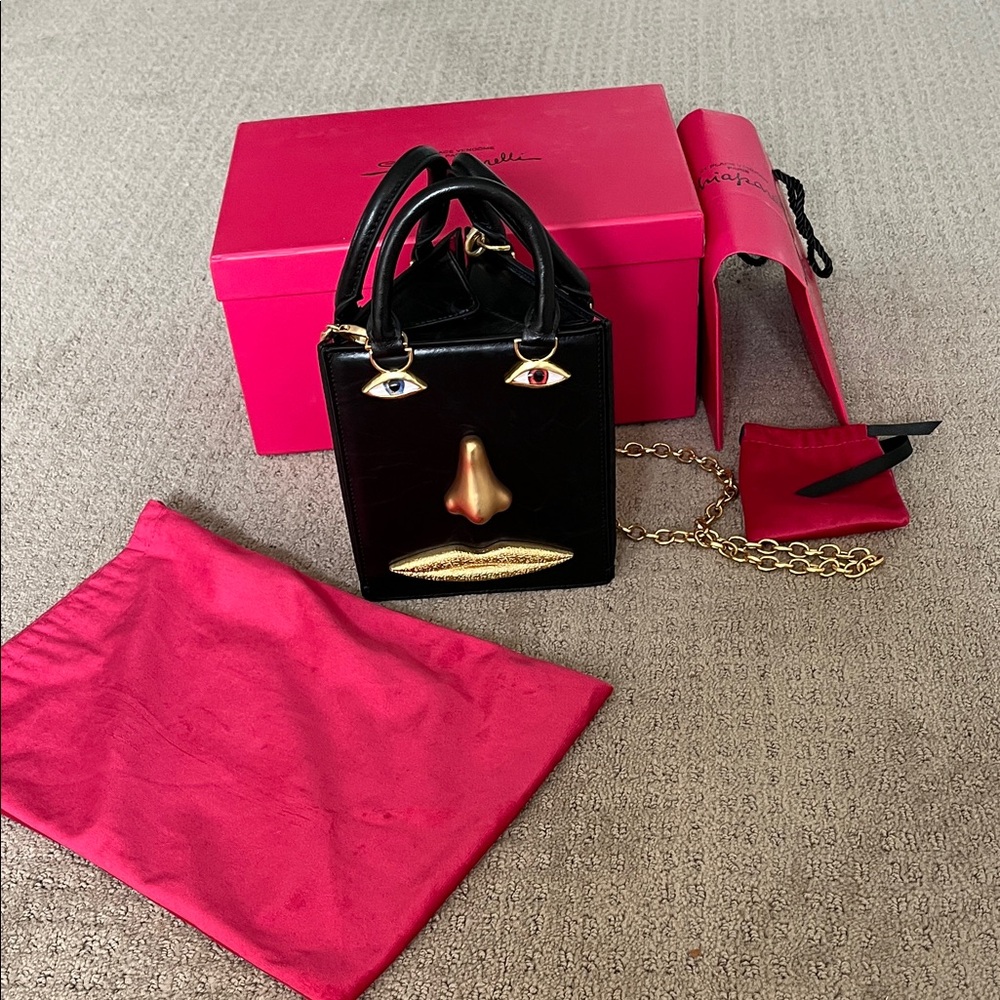Stylish Black and Gold Mini Bag with Face Design